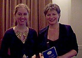 Ms. Acksteiner from "Deutsche Welle Radio & Television" is introducing  Maria to the public